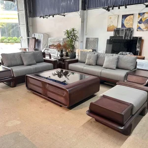 Bộ Sofa Gỗ Tự Nhiên Chân Thuyền Bàn Trà Mặt Kính Chạm Sóng Bọc Da Xám Ghi